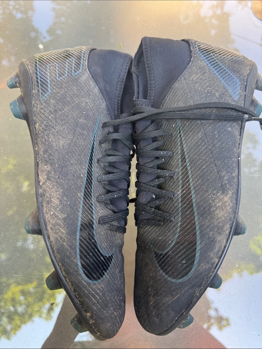 Nike Men’s Black Soccer Cleats with Subtle Blue Swoosh